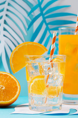 Orange juice in glass and fresh fruits