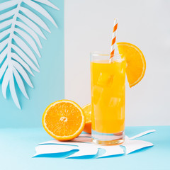 Orange juice in glass and fresh fruits