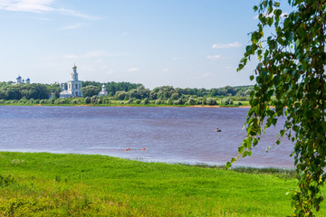 View to Volkhov river and St. George's or Yuriev Monastery in sunny day. Picturesque summer landscape and architectural landmark. UNESCO world heritage site. Velikiy Novgorod, Russia