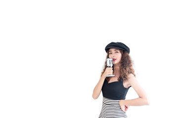 Confident young hipster asian girl with curly long hair holding vintage microphone singing song karaoke isolated on white background. Entertainment people in party concept