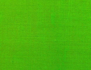Textured background of green natural textile    