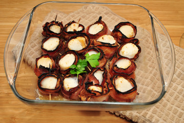 Large Sea Scallops Wrapped with  Bacon in a Baking Dish 