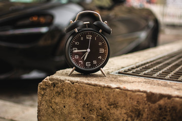 Clock in front of a Car