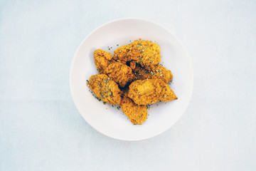 Chicken Wings Spicy chicken wings, breaded, fried, cooked.