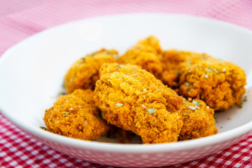 Chicken Wings Spicy chicken wings, breaded, fried, cooked.