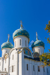 Fototapeta na wymiar Dormition Cathedral or Uspensky sobor of Holy-Trinity St. Sergius Lavra against blue sky. Sergiyev Posad, Moscow region, Golden ring of Russia. UNESCO World Heritage Site