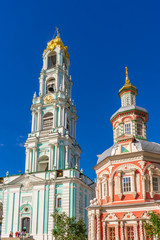 Fototapeta na wymiar Chapel and Bell tower of Holy-Trinity St. Sergius Lavra against blue sky. Sergiyev Posad, Moscow region, Golden ring of Russia. UNESCO World Heritage Site