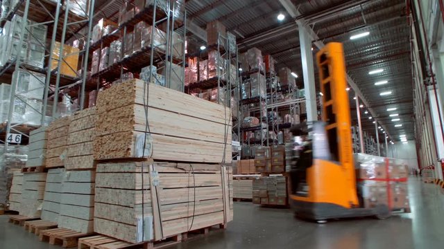 A variety of goods and cargo on the shelves in a large warehouse