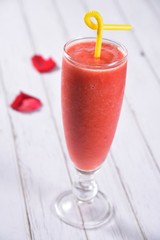 red cocktail with strawberry