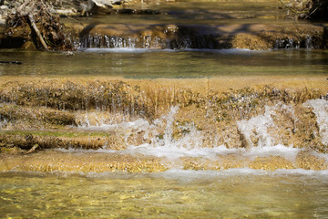 the river flows in the mountains in spring