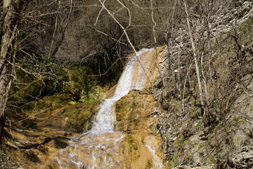 the river flows in the mountains in spring