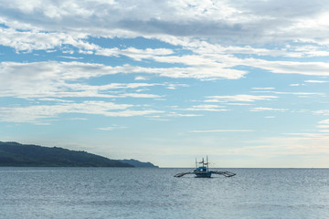 Obraz premium Classic Philippine fishing boat on the background of the sea landscape.