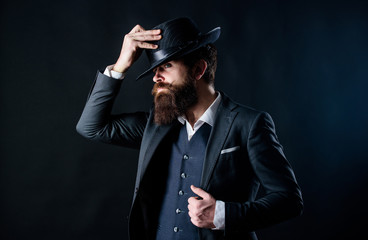 Man with hat. Vintage fashion. Man well groomed bearded gentleman on dark background. Male fashion...