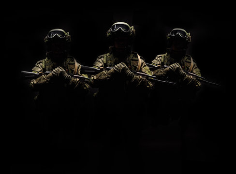 russian special forces soldier with rifle on dark background. army, military and people concept