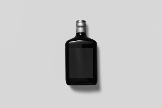 Alcohol bottle isolated on white background. Tincture, liqueur, balsam, whiskey, cognac, brandy. Mock up for you design. High resolution photo.