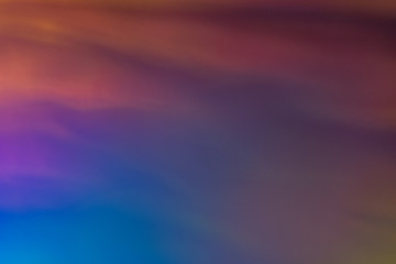 Blurred blue and orange abstract lens flare background. Defocused glow. Illuminated soft shine