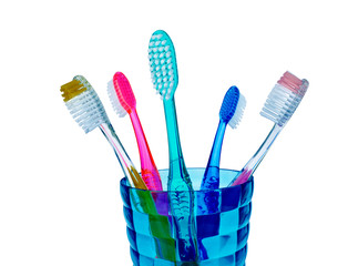 Toothbrushes in a glass isolated on white