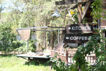 Obraz premium Black wooden sign in the garden.