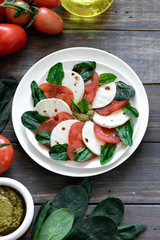 Caprese salad with pesto and balsamic vinegar 