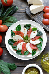 Caprese salad with pesto and balsamic vinegar 