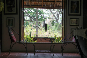 Steel furniture by the window in the room.