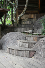 The old wooden stairs between two stones.