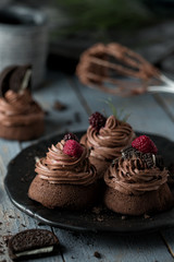 Chocolate cupcakes on rustic wooden table
