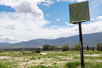 Abandoned golf driving range course in Borrego Springs, California. Only a rusty sign remains
