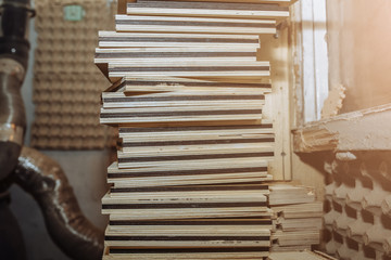 Empty wooden frames and boxes lying on the big pile. Handmade working process.