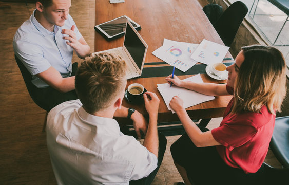 Young Man and woman group working with laptop in coffee shop cafe