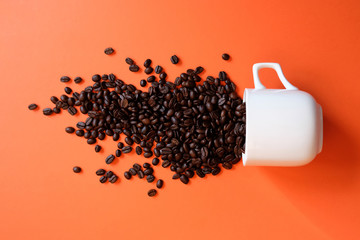 Coffee beans in coffee cup isolated on white
