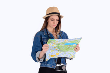 Young tourist woman looking at map.