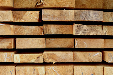 Stacked stack of wooden boards, wooden background
