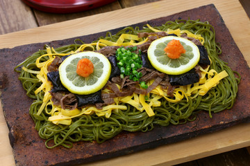 kawara soba, japanese local food,  fried green tea buckwheat noodles on roof tile