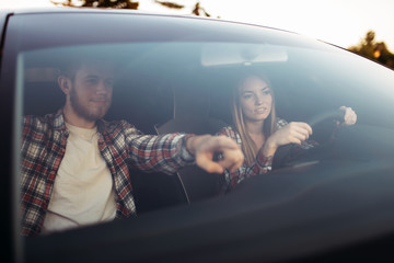 Male instructor and woman student, driving lesson