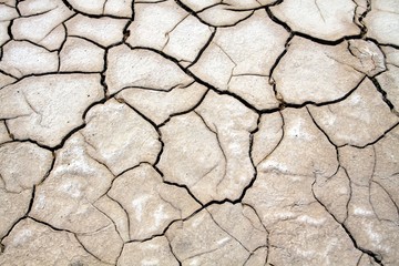 Obraz premium Cracked eroded ground in salt flat desert near San Pedro de Atacama, Chile