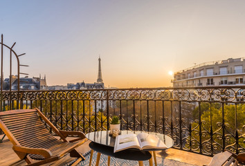 beautiful paris balcony at sunset with eiffel tower view  - obrazy, fototapety, plakaty