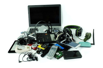 Pile of electronic waste, gadgets for daily use isolated on white background, Reuse and Recycle concept