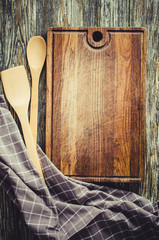 Plakat Culinary background with rustic kitchenware on vintage wooden table.