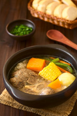 Traditional Chilean Cazuela de Vacuno or Cazuela de Carne beef soup with potato, corn, pumpkin, carrot, bell pepper, onion and rice (Selective Focus one third into the image)