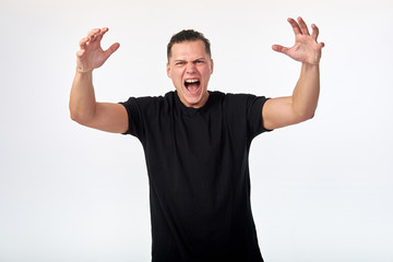 Young man screaming, quarreling. Negative feelings and human emotions.