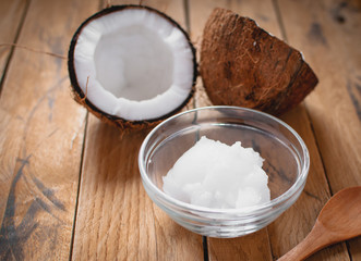 Close-up of coconut oil on wooden board 