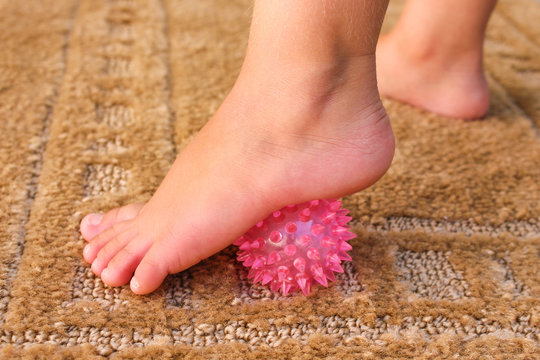 Children Does Exercise For Foot Massage Ball