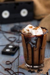 Iced coffee in glass with marshmallows retro styled