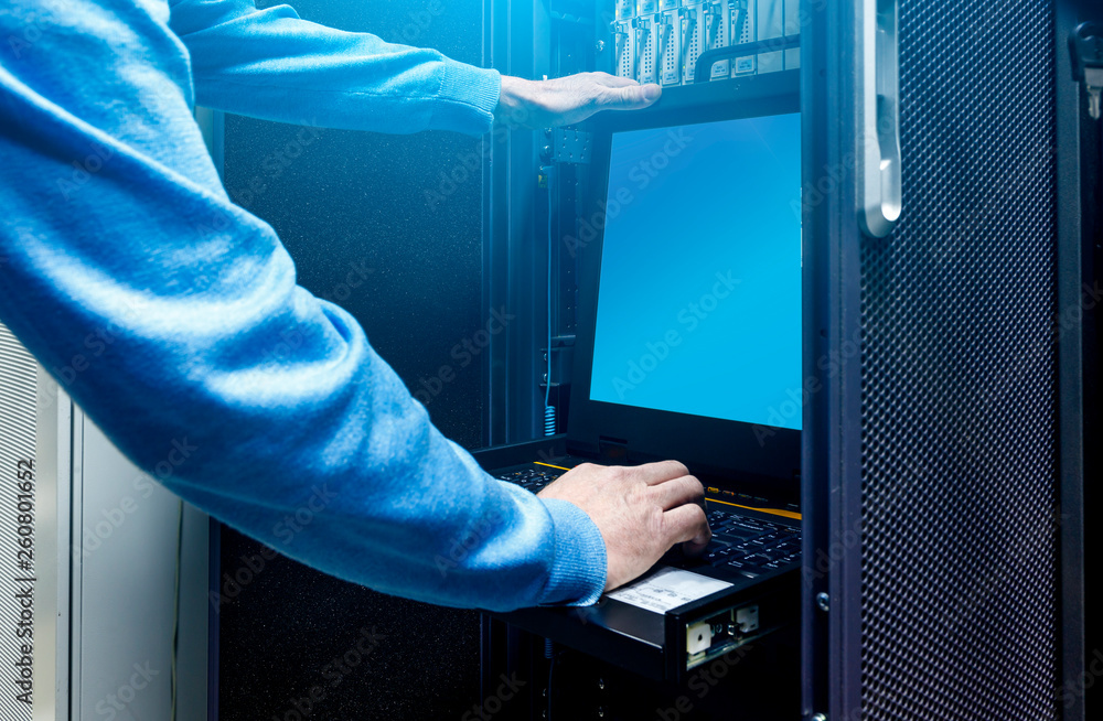 Aufkleber close up hands of male technician working on laptop and checking problem in server hardware. system 
