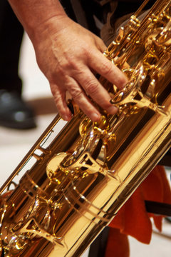 Playing brass music instrument
