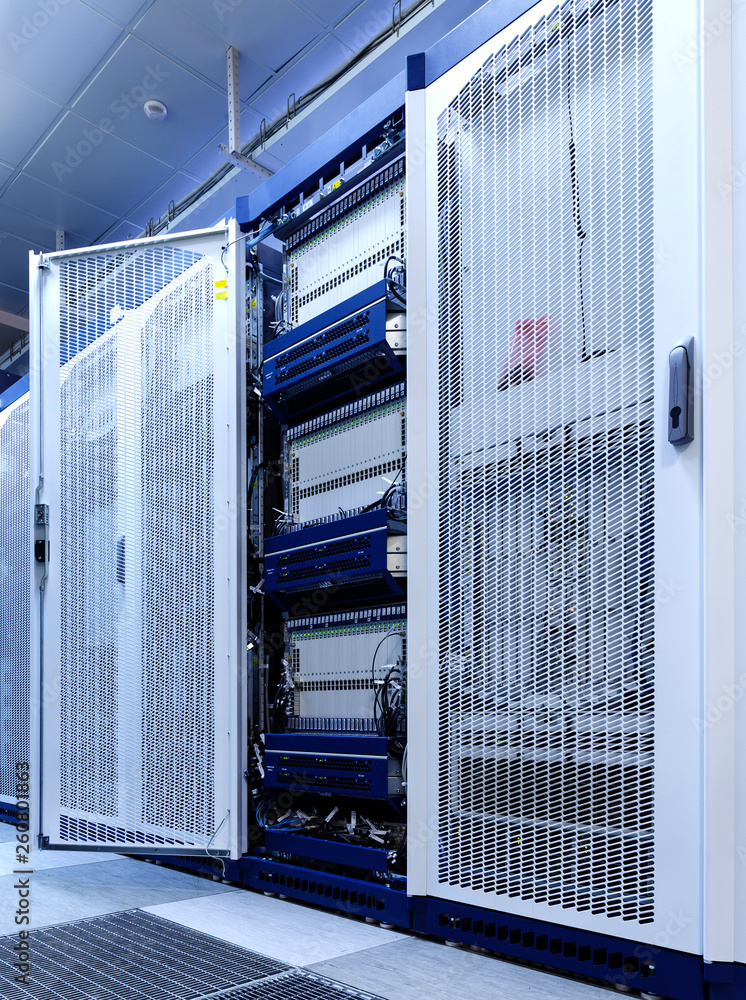 Aufkleber technical wall of cellular data terminal rows with opened mesh door.