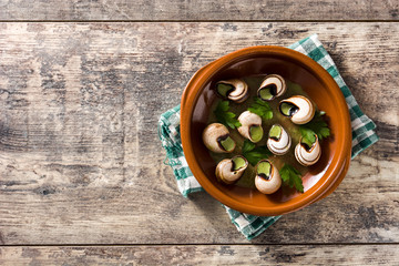 Escargots de Bourgogne. Snails with herbs and garlic butter. Top view. Copyspace