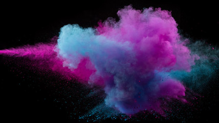 Collision of two colored powders isolated on black
