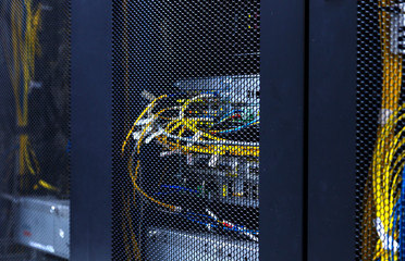 Close up optic cables and wires connection of cellular data terminal. Server equipment for cellular...